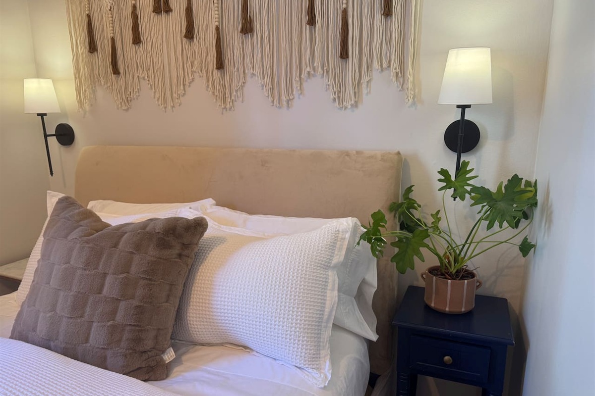 Bedroom with elegant decor comfortable soft linens and relaxing atmosphere.