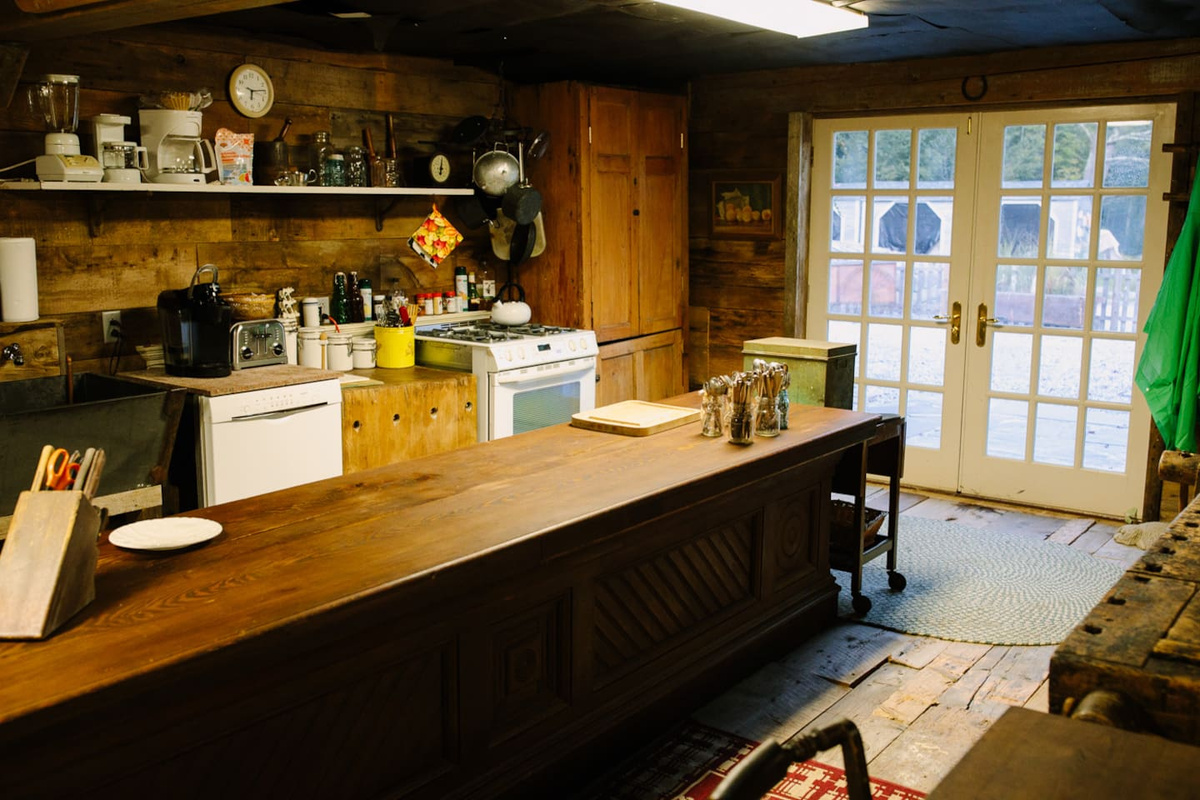 Entrance and huge kitchen with old country store counter center island.