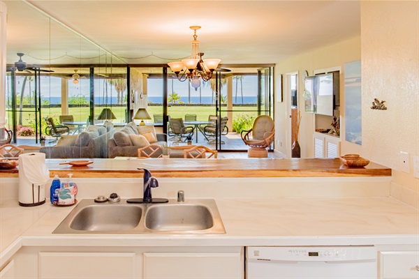 Enjoy the open living area and ocean view from the kitchen.