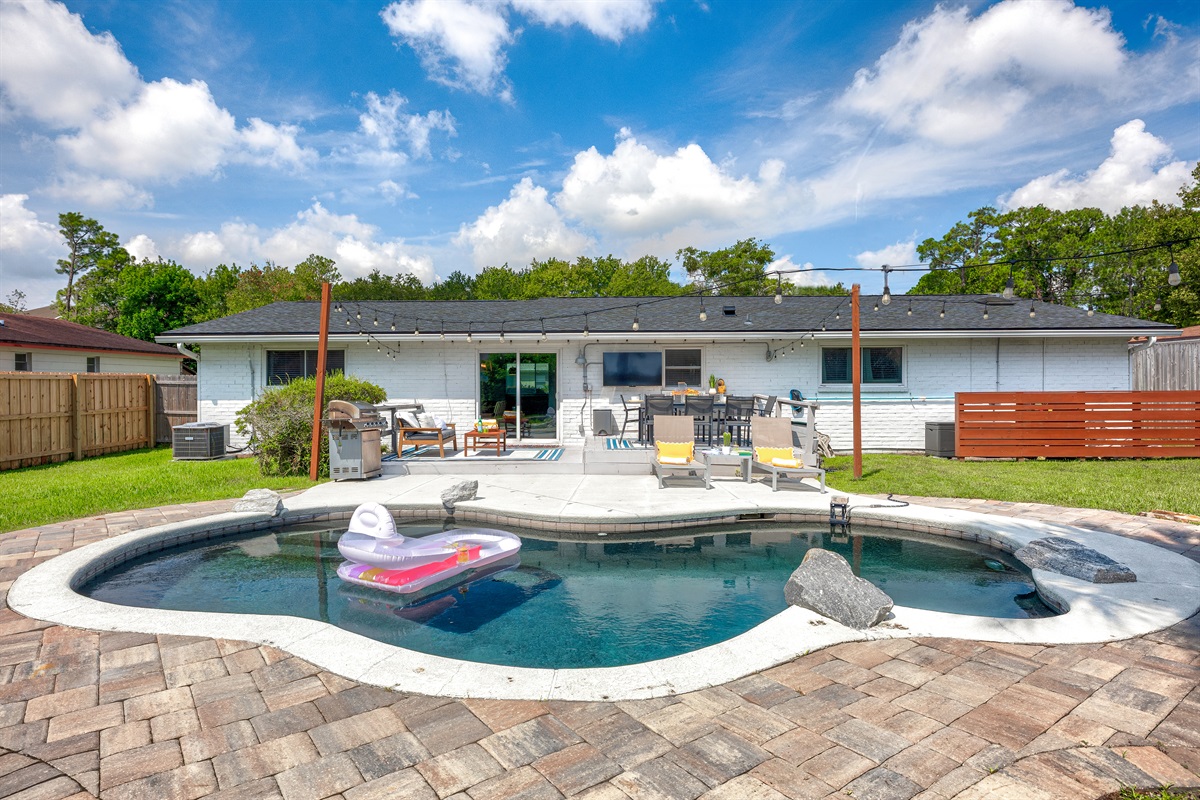 Spacious backyard with private heated pool