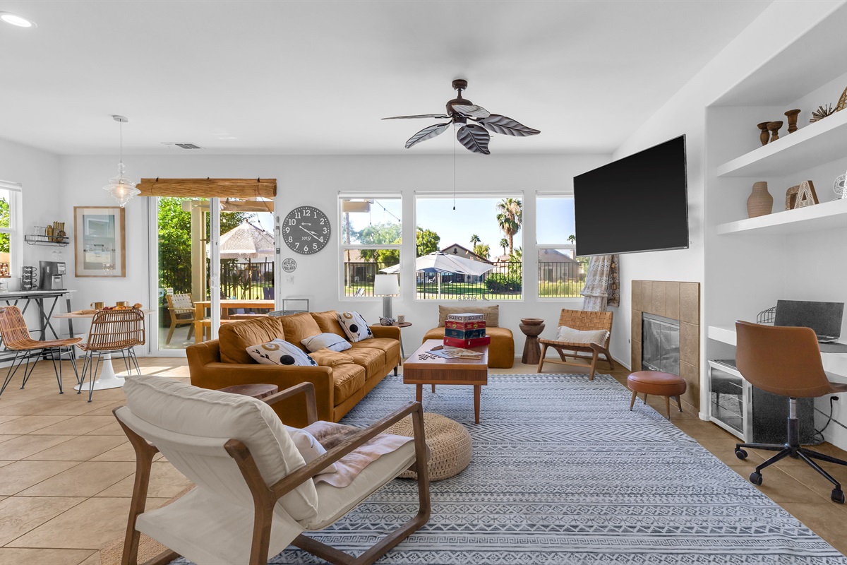 Bright Open-Concept Living Area Relax in style with golf-course views and cozy mid-century décor.