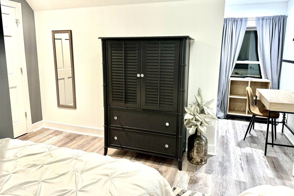 Dresser, work space chair in bedroom
