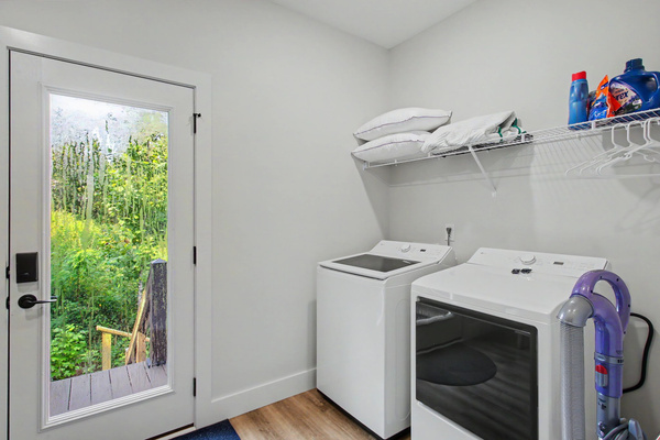 Main level laundry room, washer/dryer, and loft/deck access