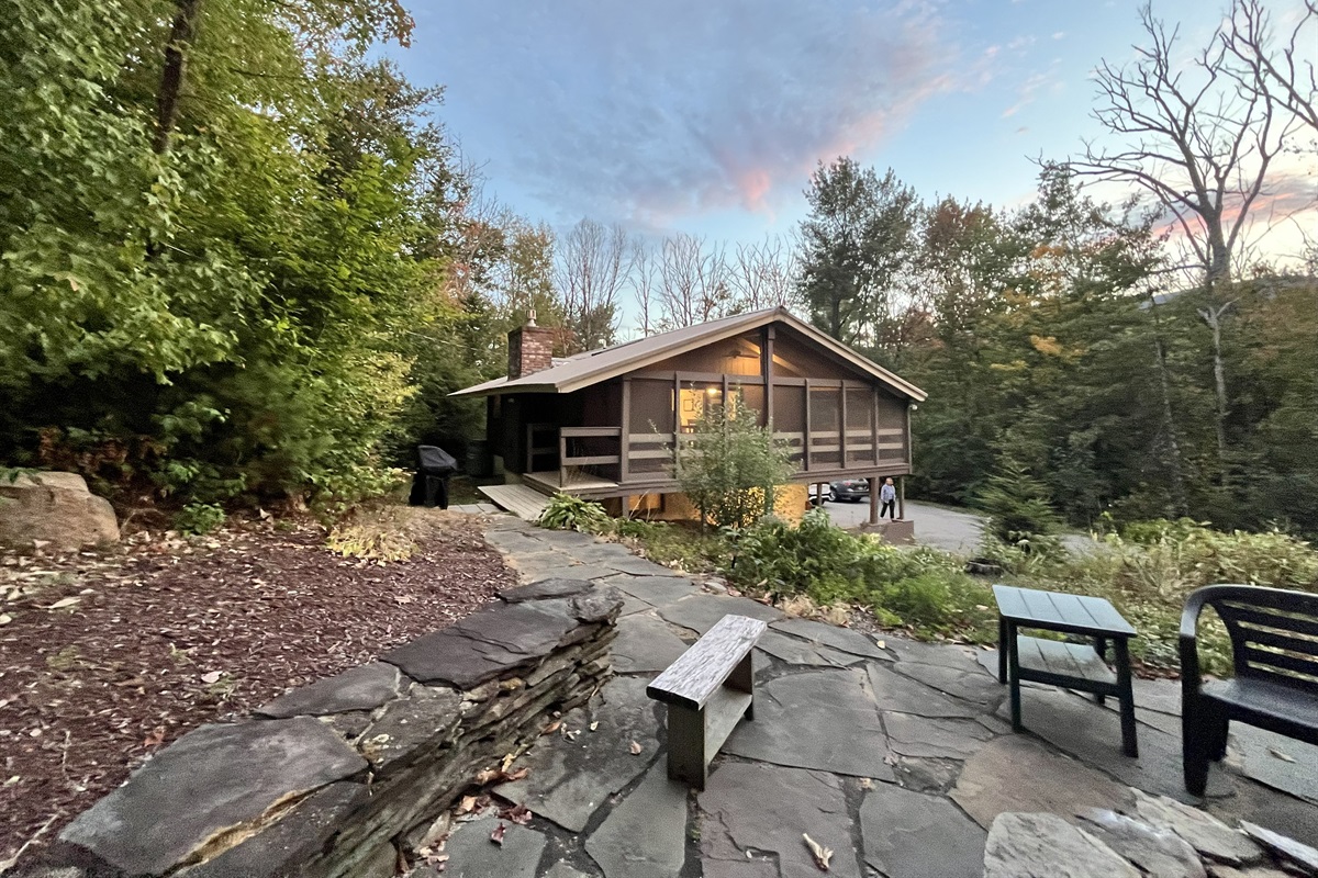 Stone fire pit & patio – Gather under the stars for s’mores and stories