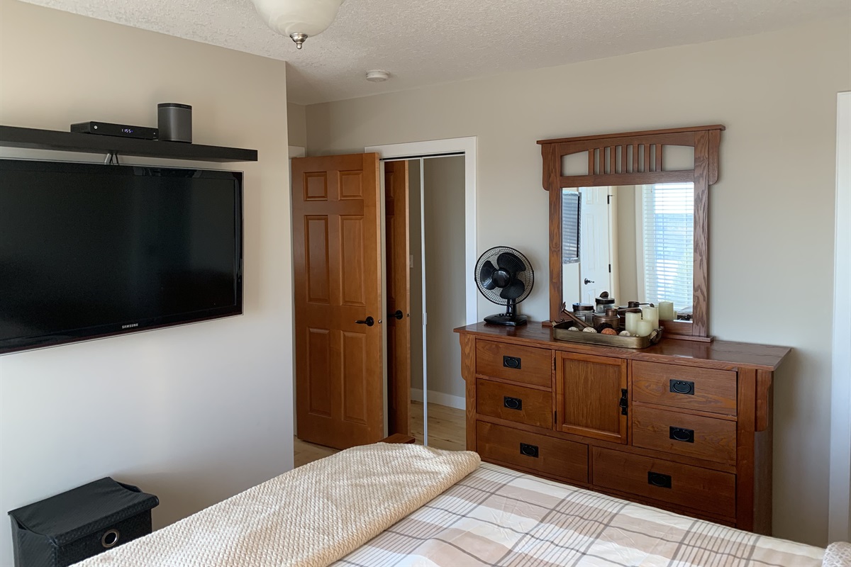 LOFT BEDROOM. WALK IN CLOSET BEHIND MIRROR DOOR.