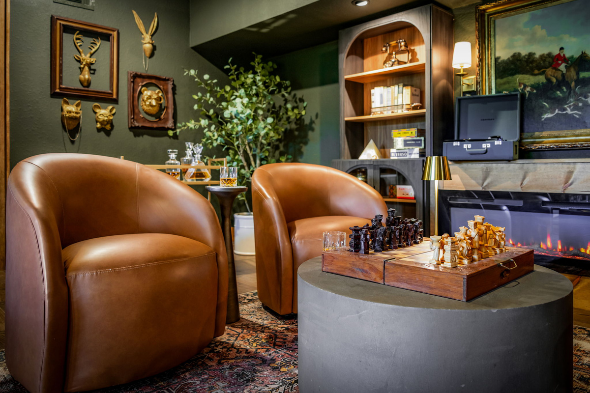 Chess in the speakeasy with fireplace