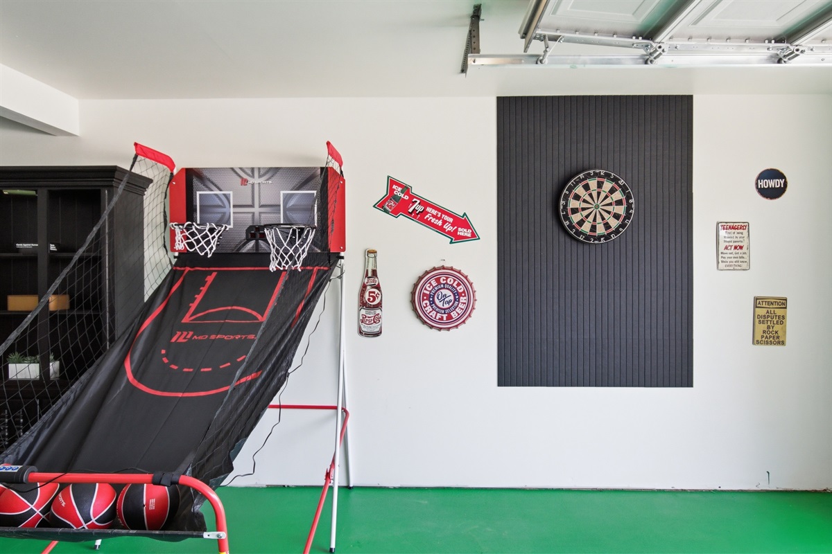 Electronic Basketball Game and Dartboard wall in the Garage Game Room. Arcade-style entertainment for groups of up to 8 guests.