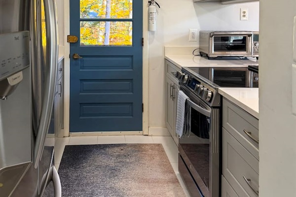 Galley kitchen on the second floor, next to the living and dining areas. 
