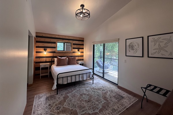 The upstairs bedroom is fitted with a queen size bed, Roku TV & private balcony overlooking the waterfront.