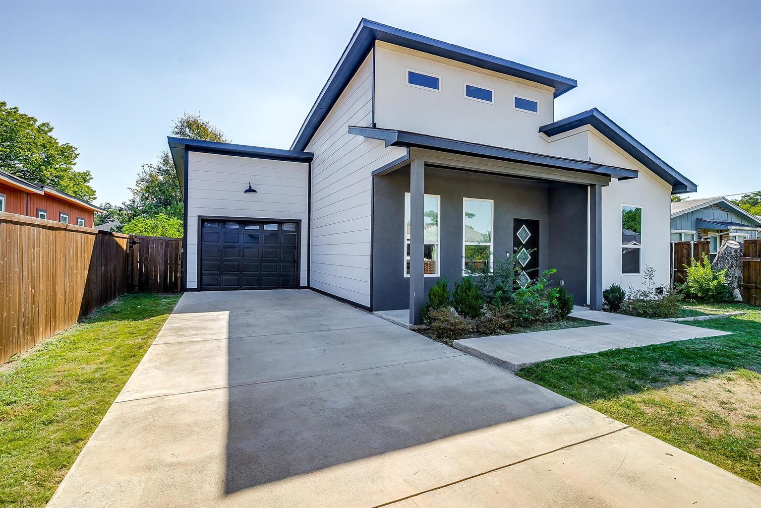 Modern curb appeal with private driveway – perfect for families or small groups.