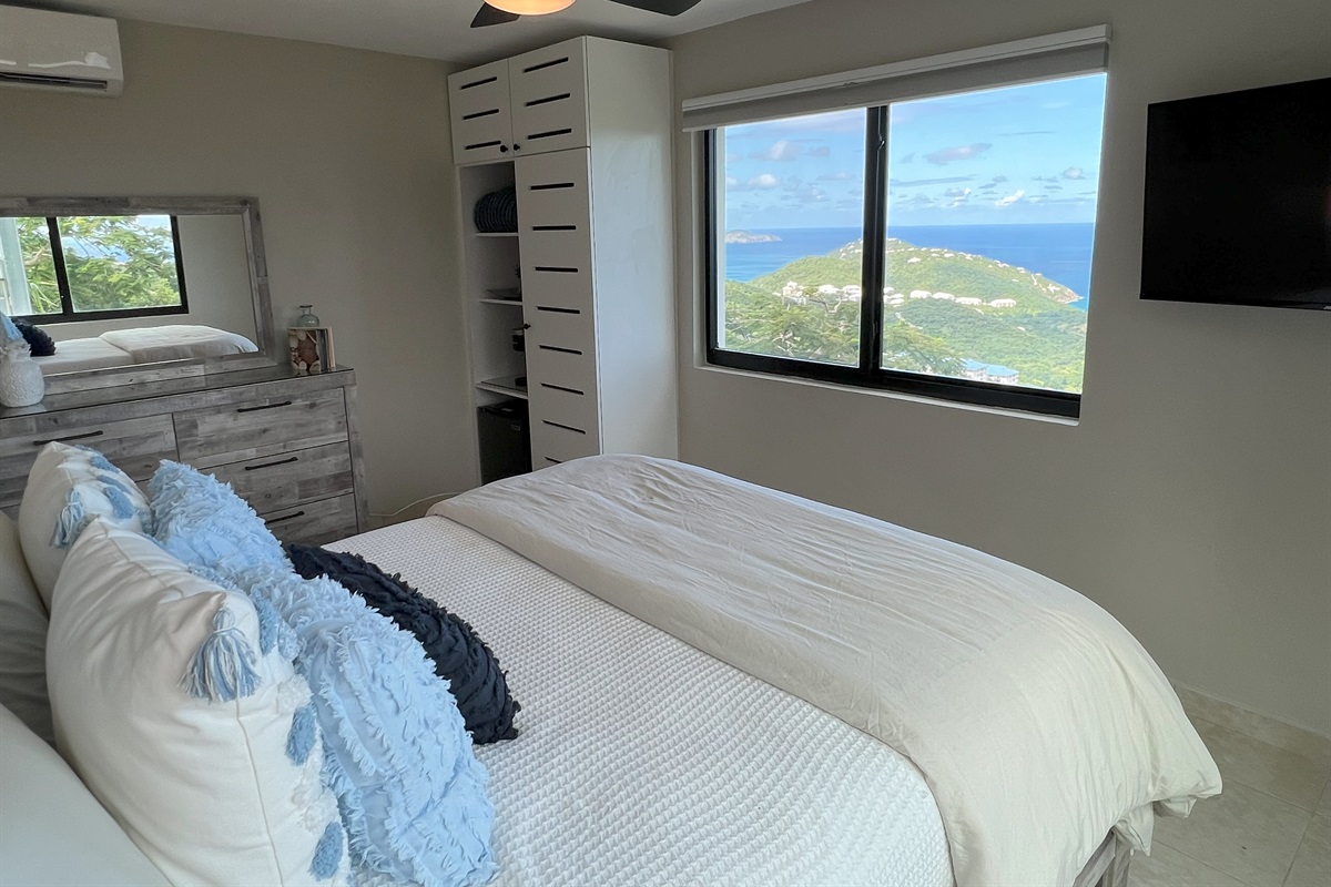 If you walk out of the front door and go down a small set of stairs, there are two additional bedrooms, each with their own bathrooms.