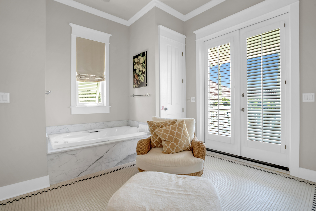 2nd floor king bedroom ensuite bathroom with double vanity, tub and shower.