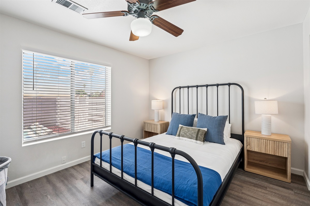 Bedroom 2 is bright with plenty of light and storage