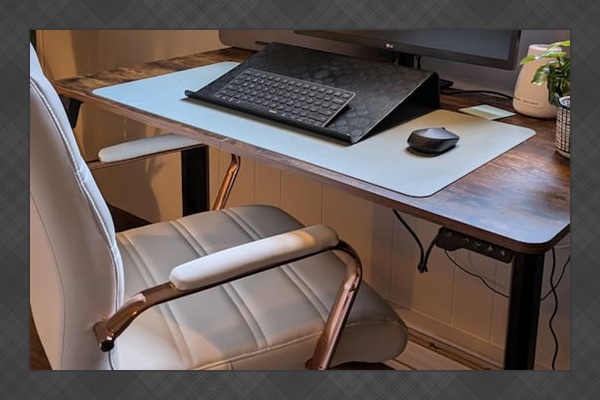 The work-cation setup - 24" LED monitor (with HDMI cable), Bluetooth keyboard and mouse, an adjustable standing desk, and a super comfy, stylish chair. Plus, a portable laptop desk means you can take your replies to the backyard or Adirondack chair.