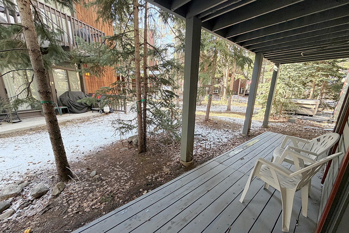Covered outdoor patio on rear side of lower level.