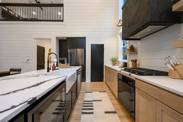 Spacious and light-filled, the kitchen offers ample prep space and effortless entertaining.
