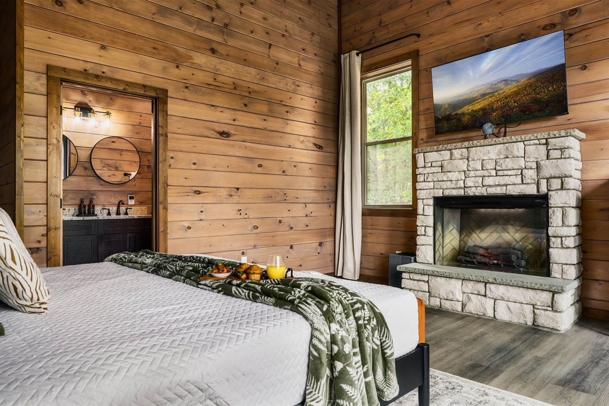 Bedroom 3: king bed on second floor with the electric fireplace, 58 inch Roku HDTV with en suite full bathroom