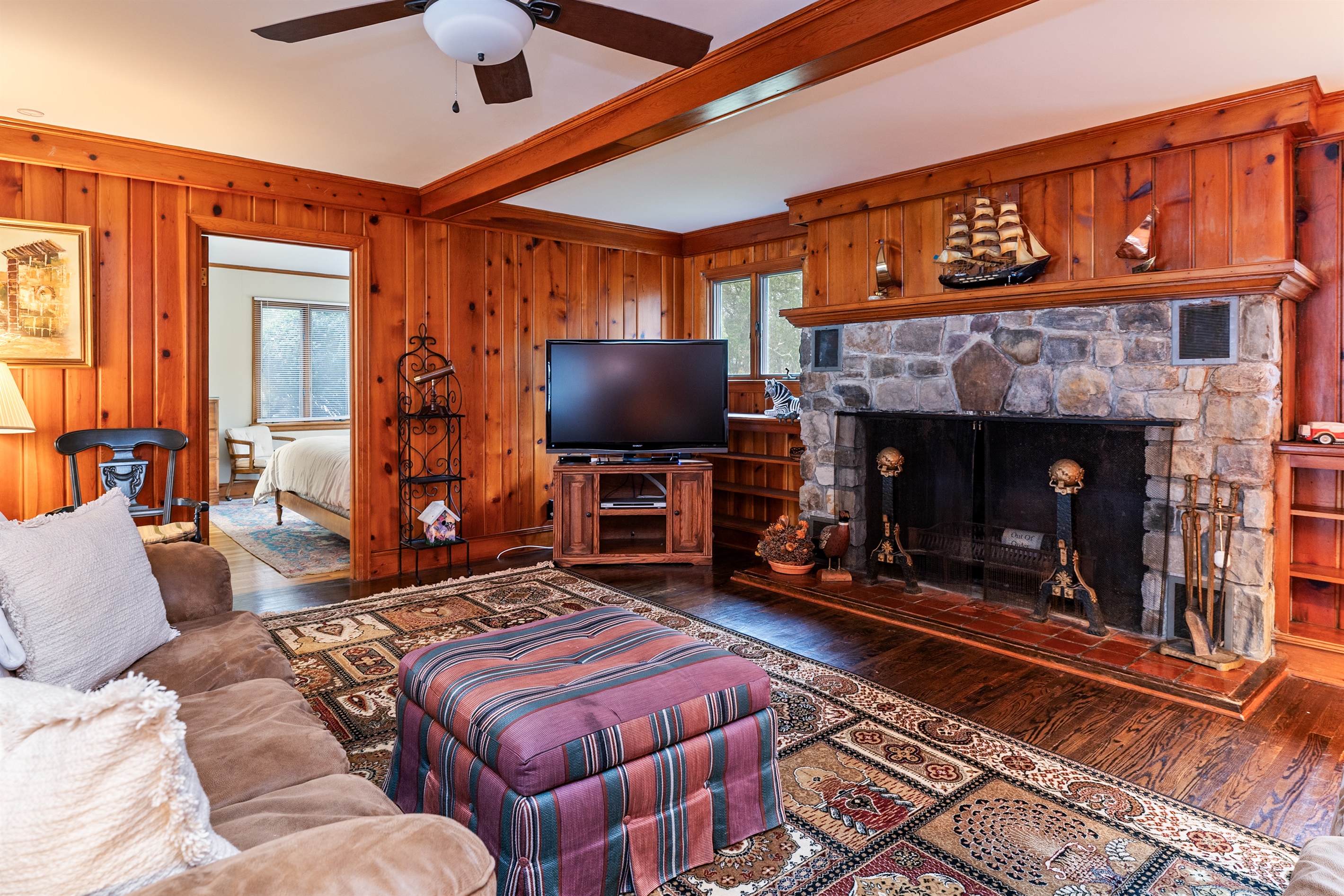 Relax and unwind in the open living room with wood fireplace(not usable by guests)main house