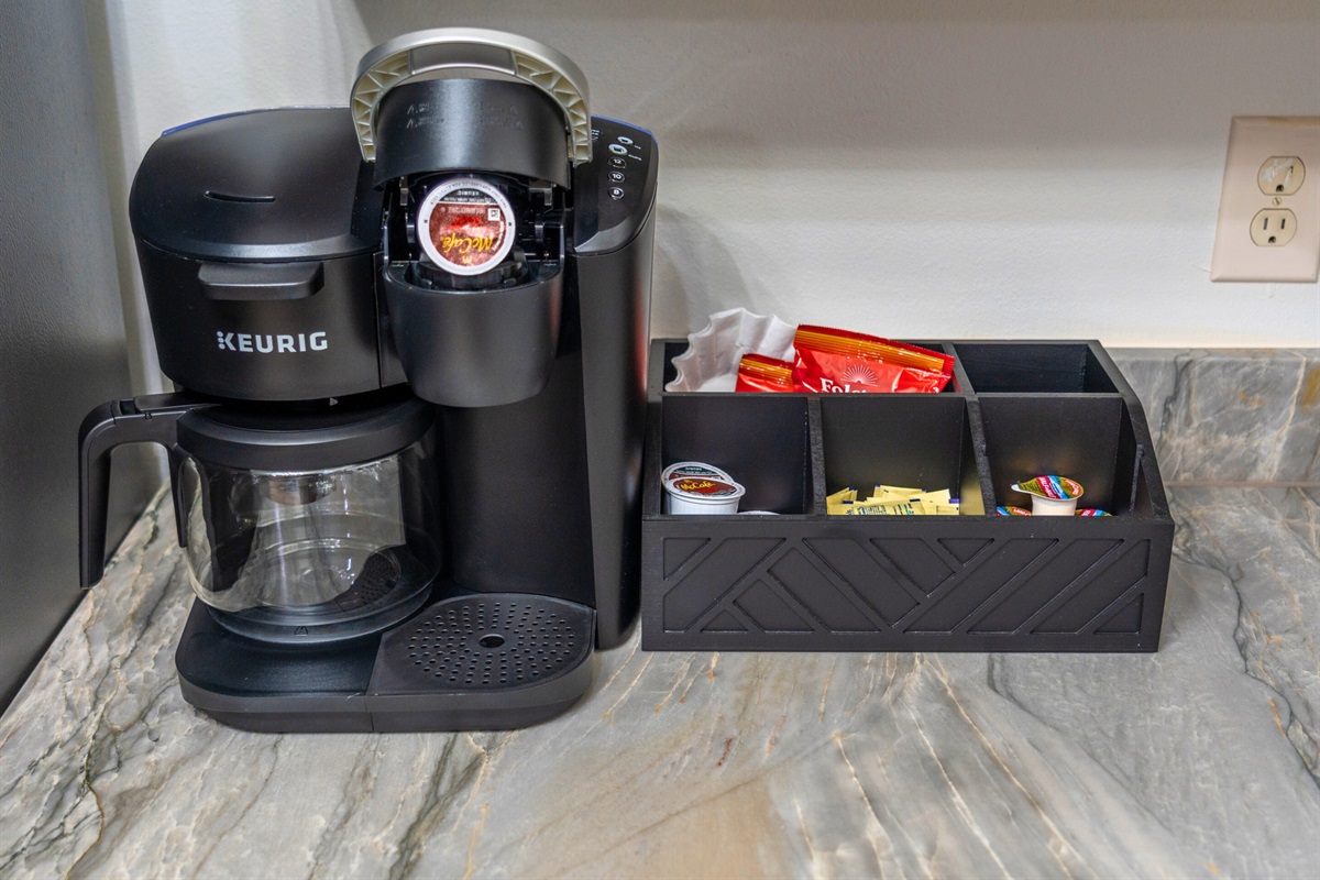 Start your mornings right with a coffee station featuring a Keurig and everything you need for the perfect brew—because a good day starts with great coffee.