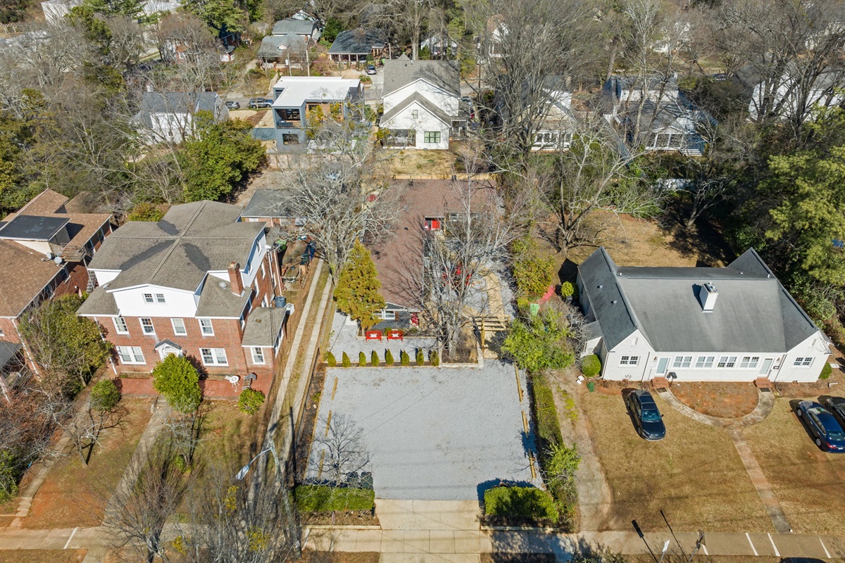 An aerial view of the property's layout, showcasing its unique design and shared duplex parking.