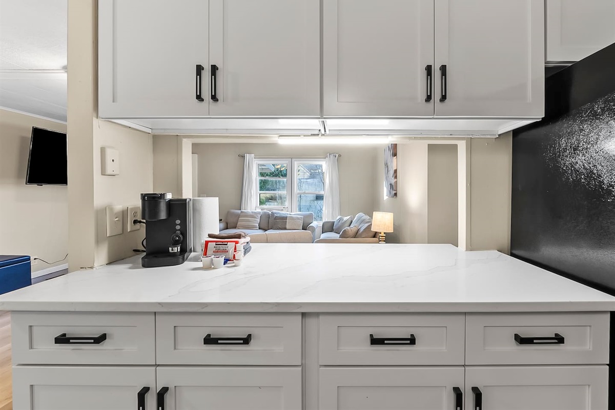 Kitchen pass-through counter connecting seamlessly to the living room for easy serving and entertaining.