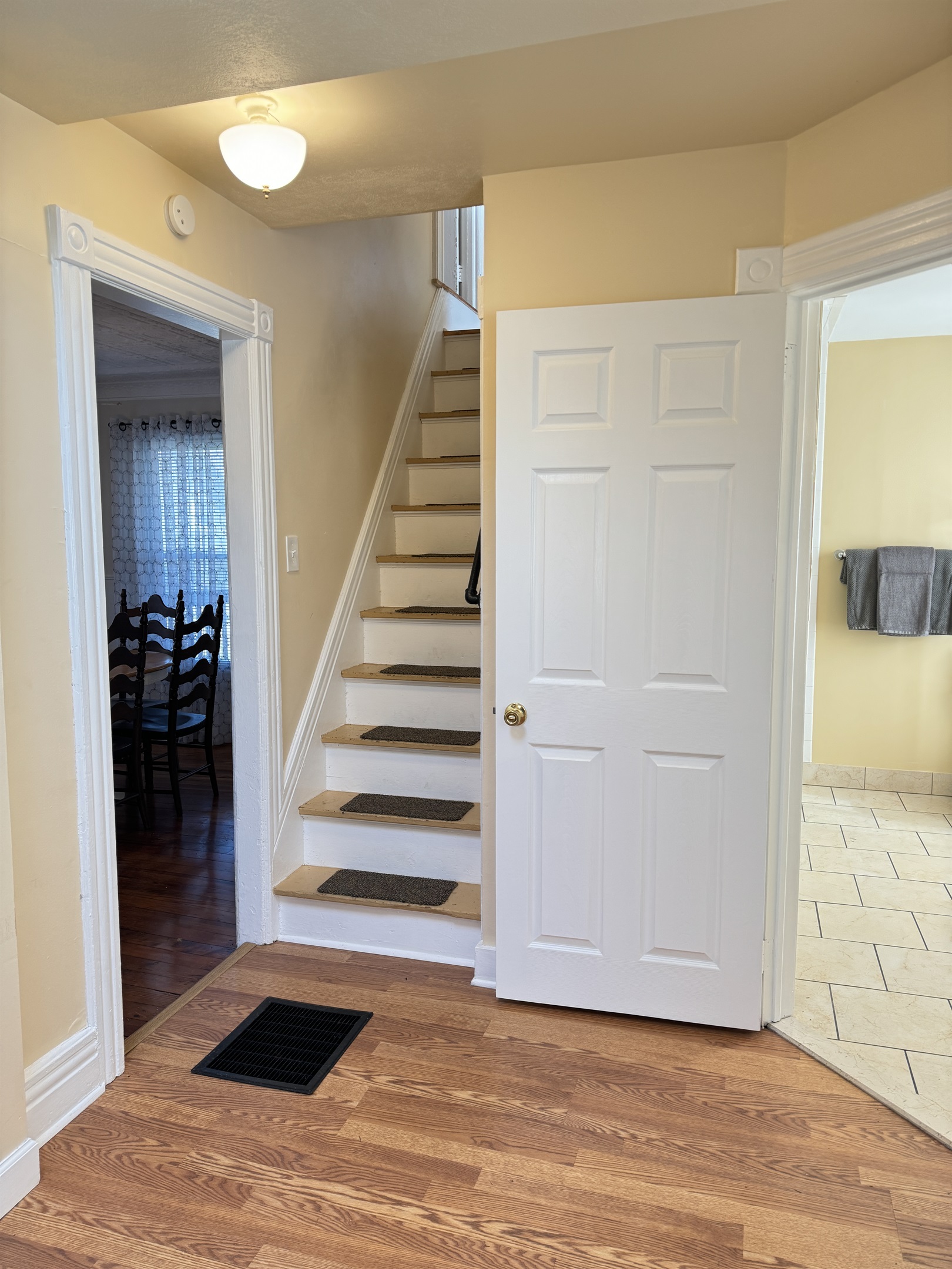Cooperstown Cottage Dining room on the left, stairs to the 2nd floor and full bathroom to the right.