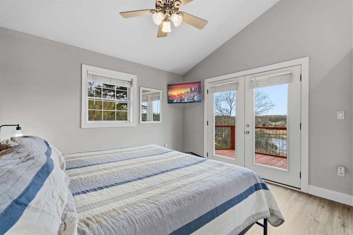 King bedroom waking up to views over the lake
