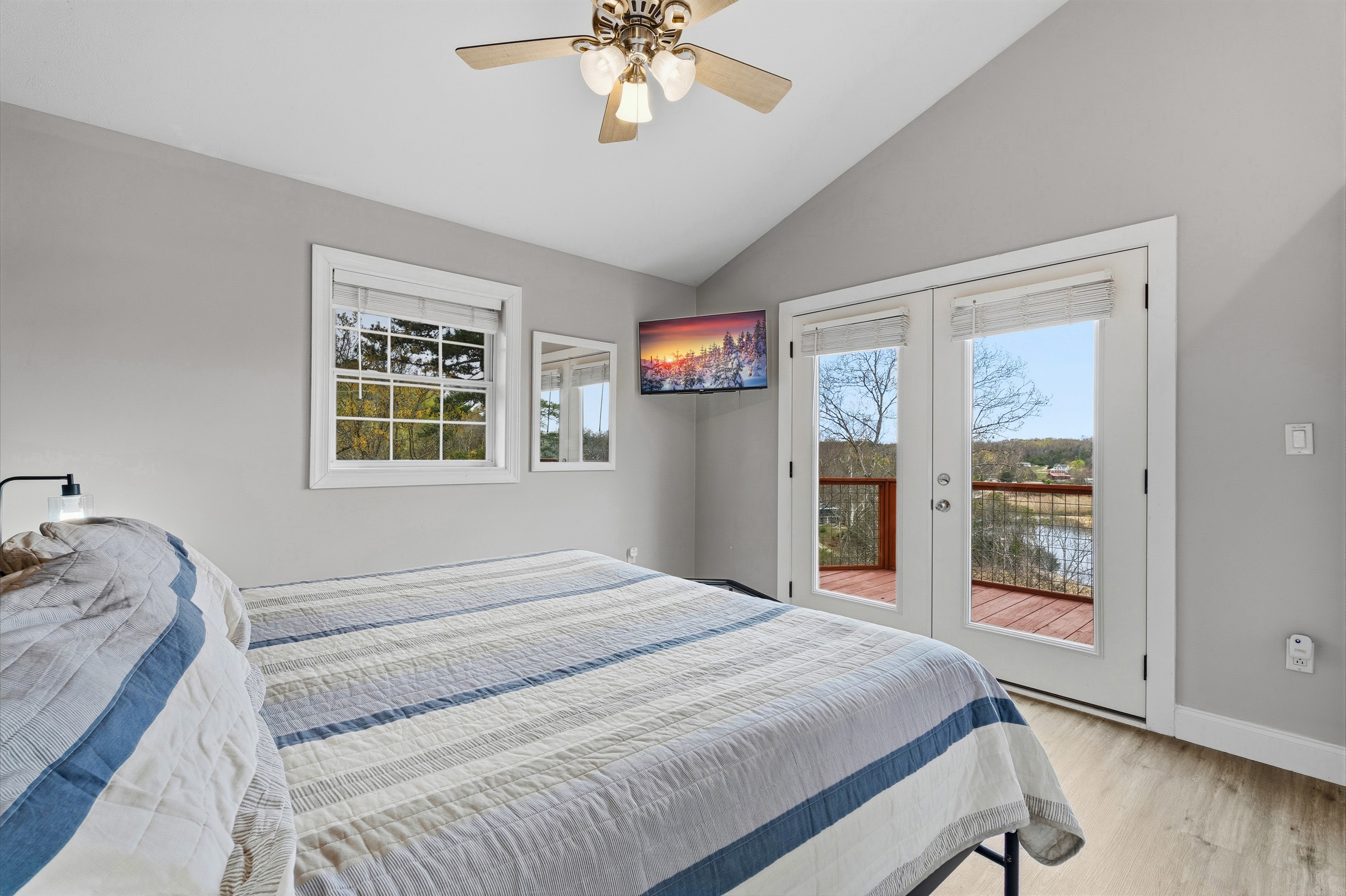 King bedroom waking up to views over the lake