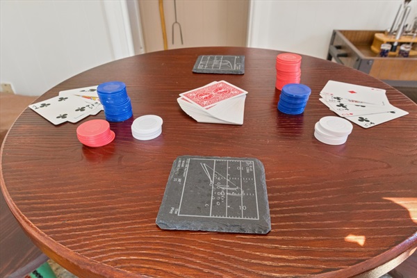 Game night, Varsity-style—our South Bend lounge features ND football highlight coasters and a mix of games on the high-top table. Unique touches celebrate Notre Dame spirit and legacy.