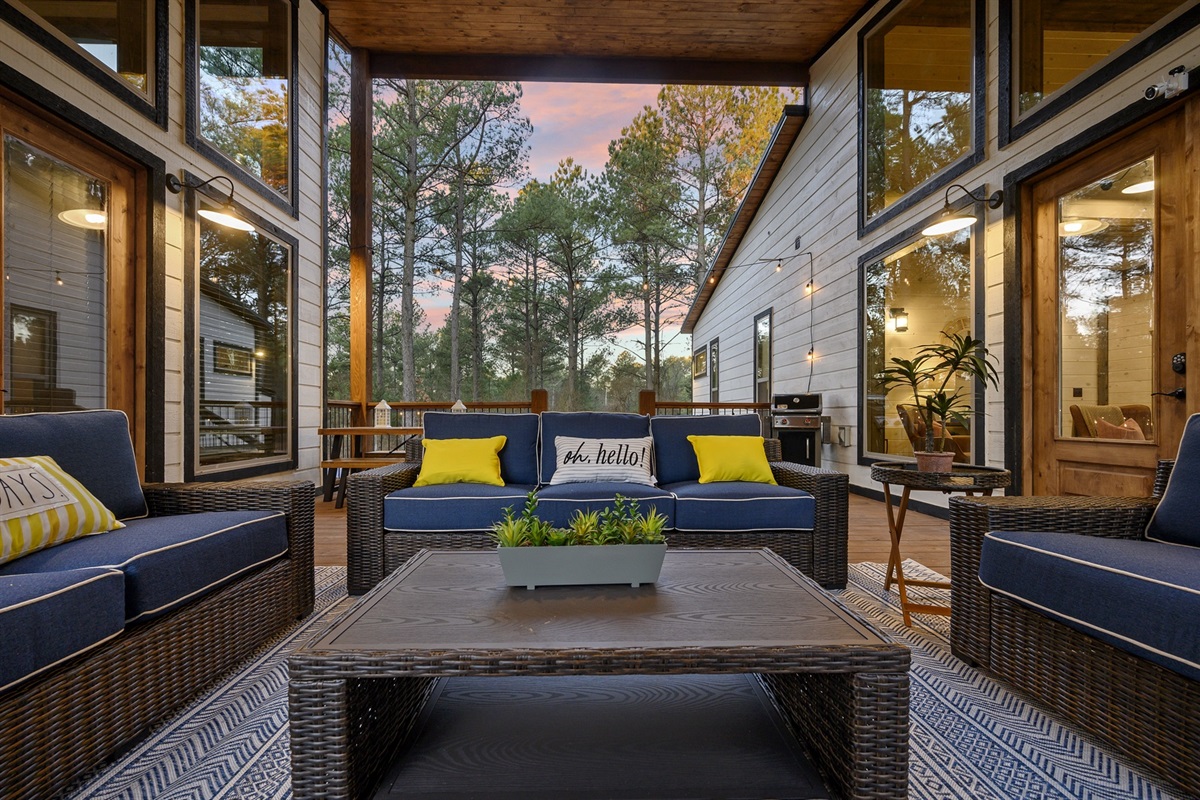 Lounge fireside, surrounded by forest views and warm cabin glow.