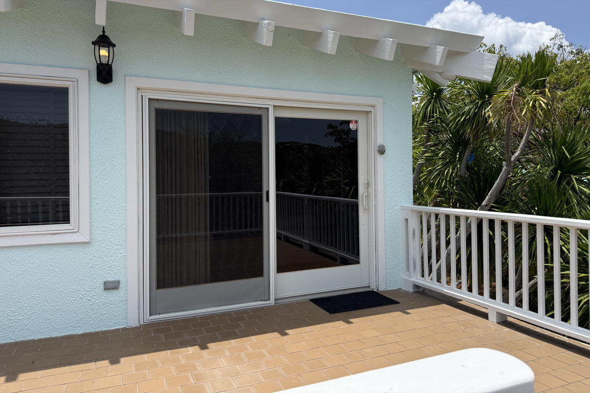 Bedroom 6 is located over the garage, up a flight of steps.