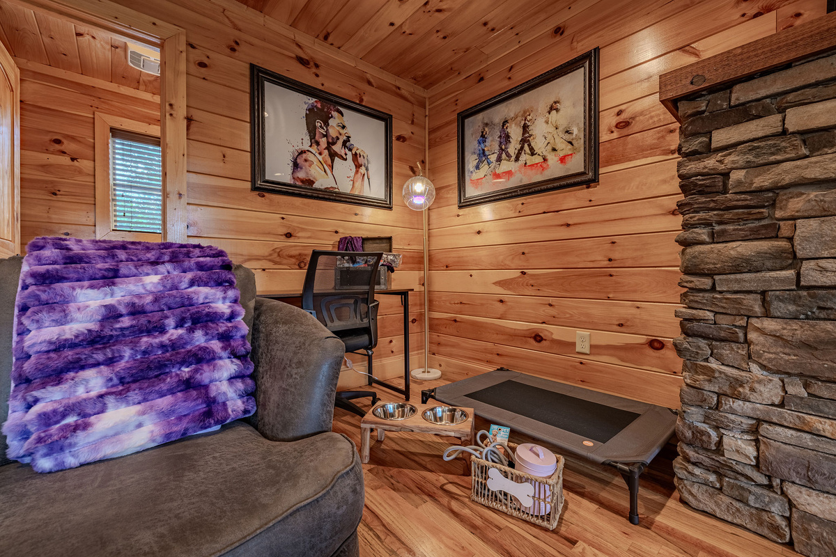 The Grand Lounge is the heart of Headliner Hideaway, with warm wood, comfortable seating, a fireplace, and space for the whole group to gather.