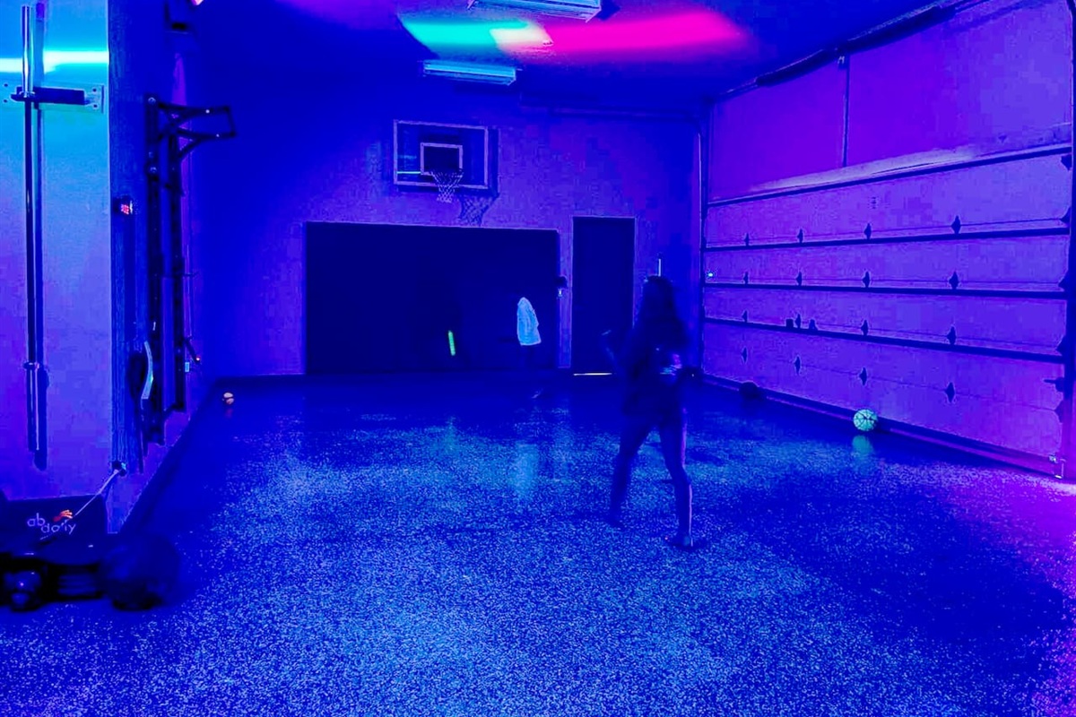 Glow in the dark floor in garage with blacklights on for dodgeball, basketball and hockey!