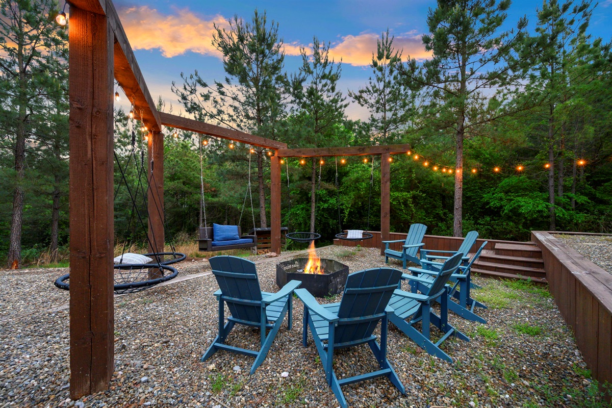 Gather around the fire pit with seating for the whole group—your go-to spot for relaxing nights at this Broken Bow cabin.