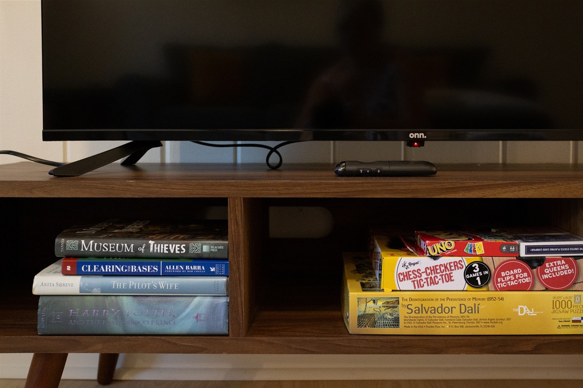 Unwind with a selection of games and books—perfect for a relaxing evening in.