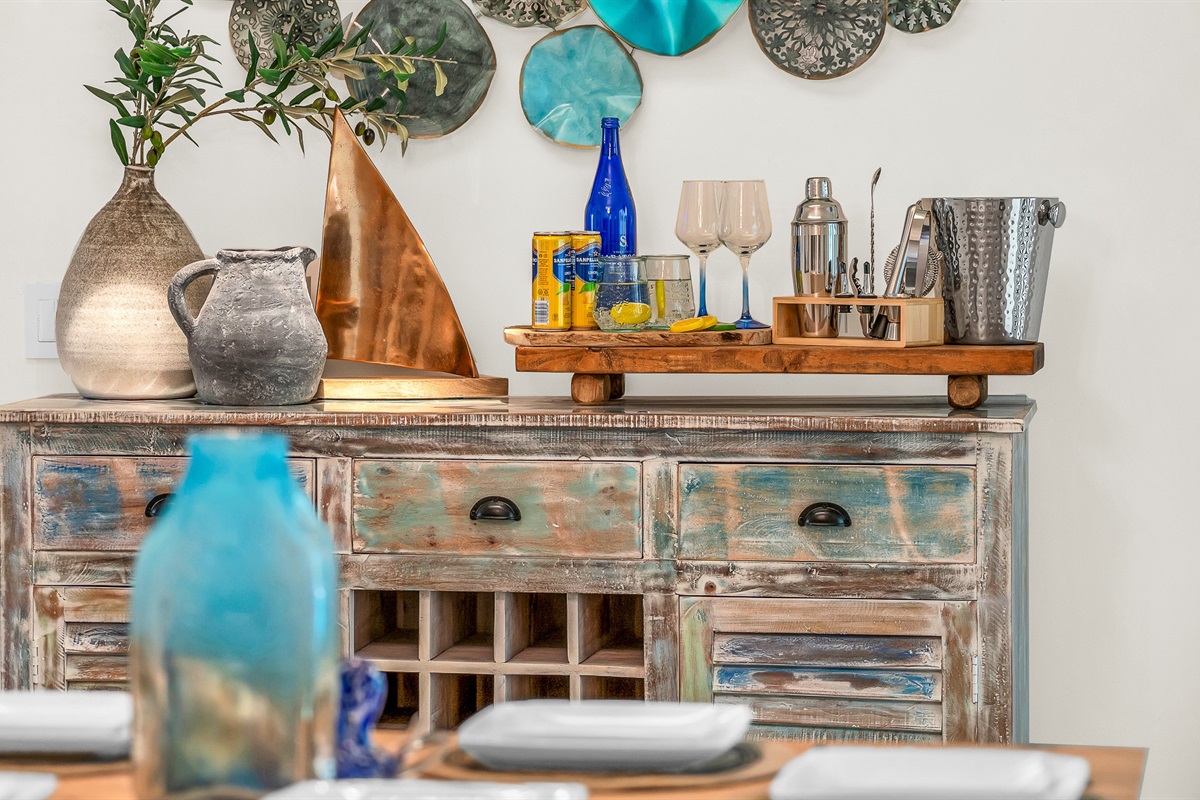 Coastal elegance meets relaxed charm with this beautifully styled console- featuring driftwood tones, ocean-inspired accents, and a curated bar setup