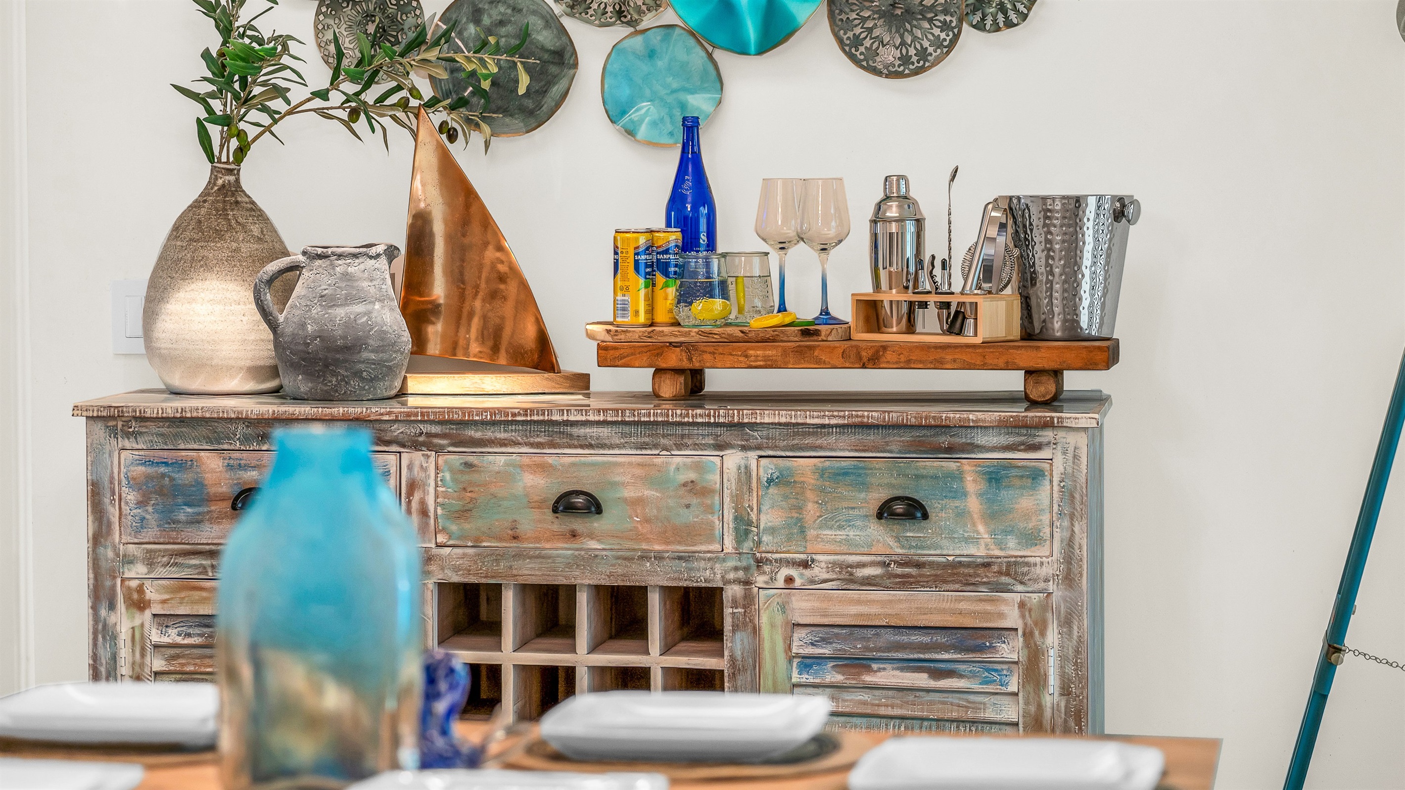 Coastal elegance meets relaxed charm with this beautifully styled console- featuring driftwood tones, ocean-inspired accents, and a curated bar setup