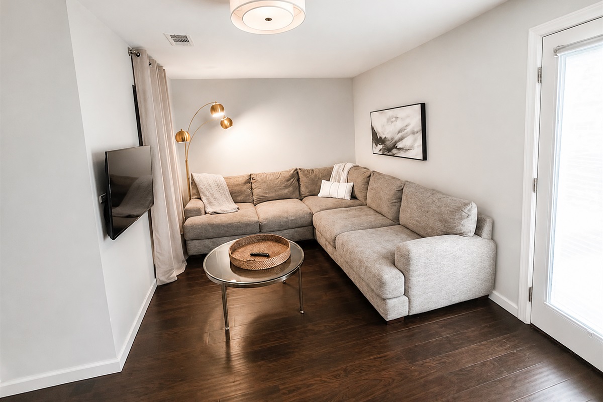 Comfortable bonus living space with sectional seating and private TV area for extra relaxation and flexibility