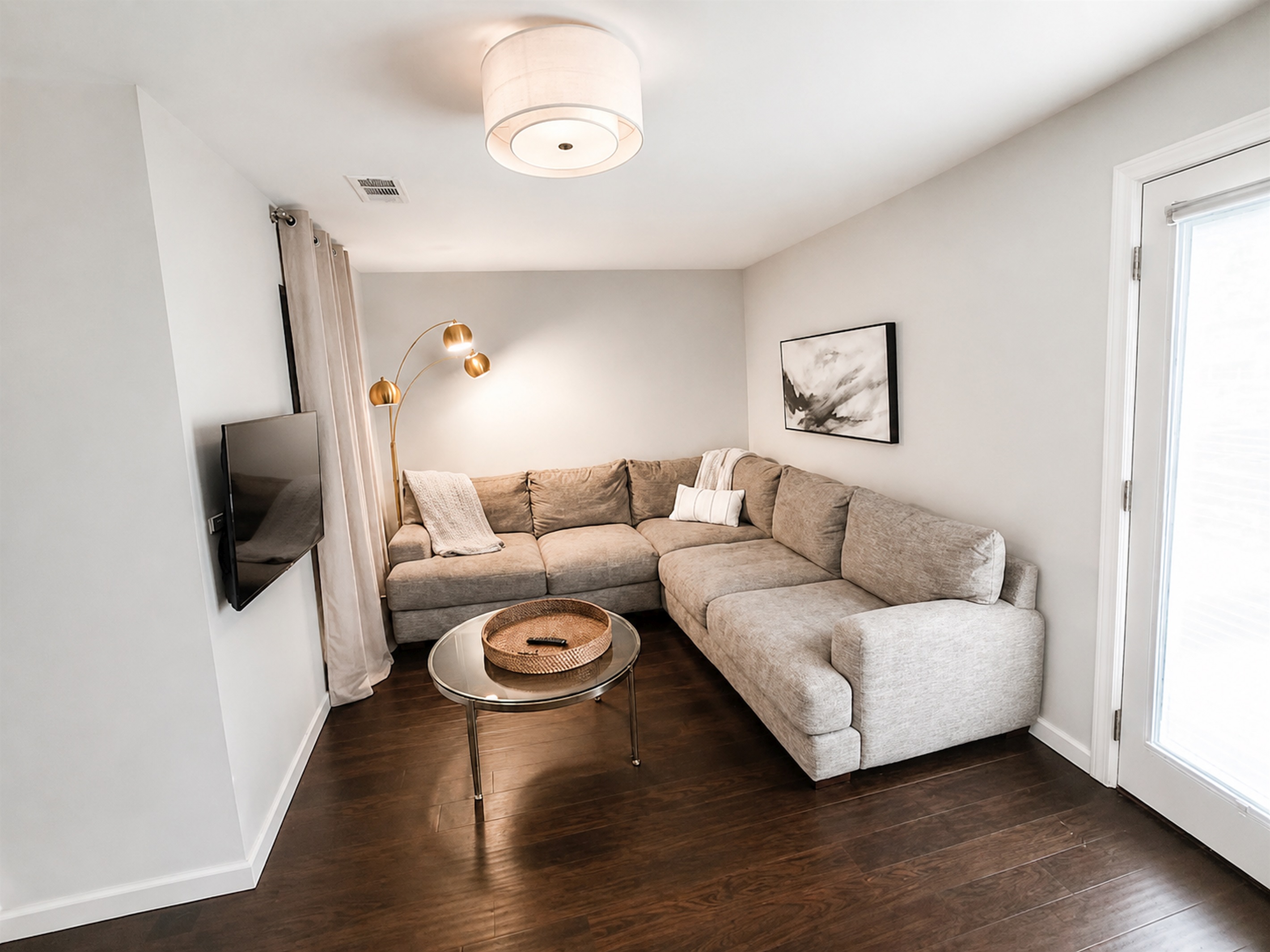 Comfortable bonus living space with sectional seating and private TV area for extra relaxation and flexibility