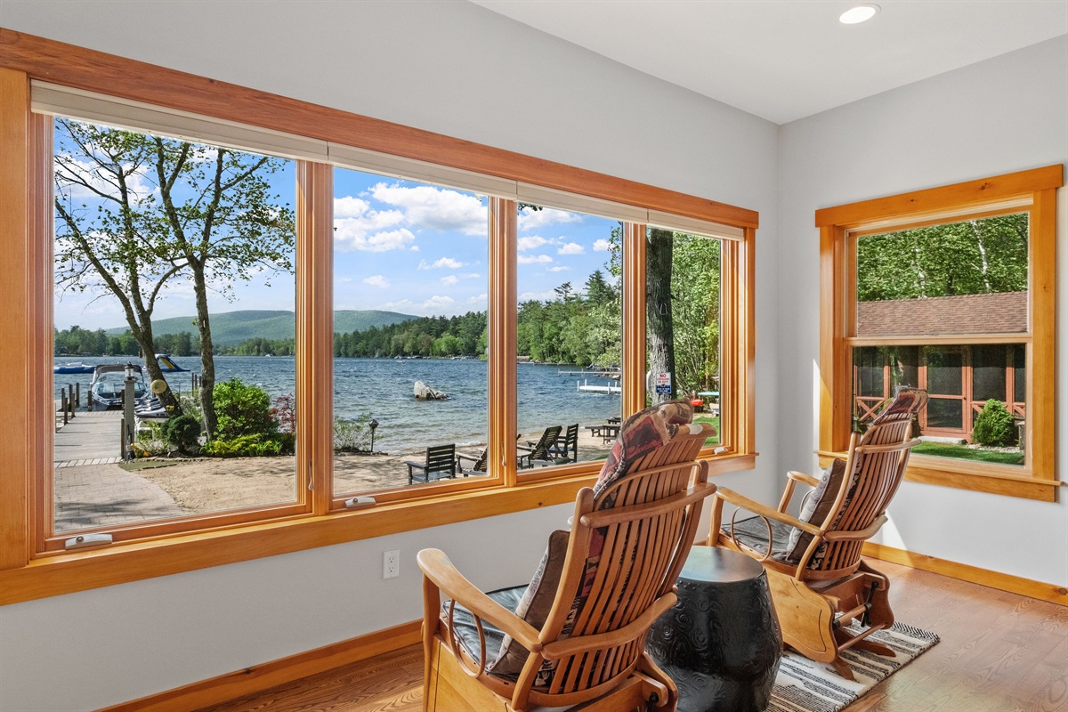 Sunroom overlooking lake and mountain views, great for watching guests on the beach and enjoying the sunsets.