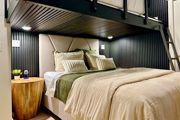 Acoustic wood and felt slat panels surround the bunk bed above and below.  It is custom made from 2 x 6 steel beams and anchored directly to the walls - incredibly strong, quiet and a great place for kids to hide out and enjoy their own TV