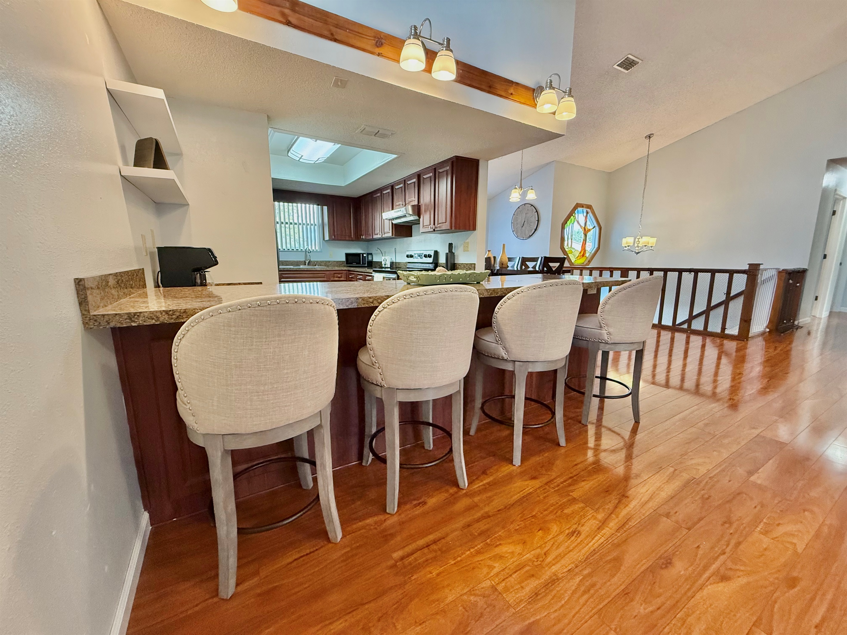 The extended countertops double as a bar, making this kitchen a great hub for casual dining, wine and cheese nights, or morning coffee chats.
