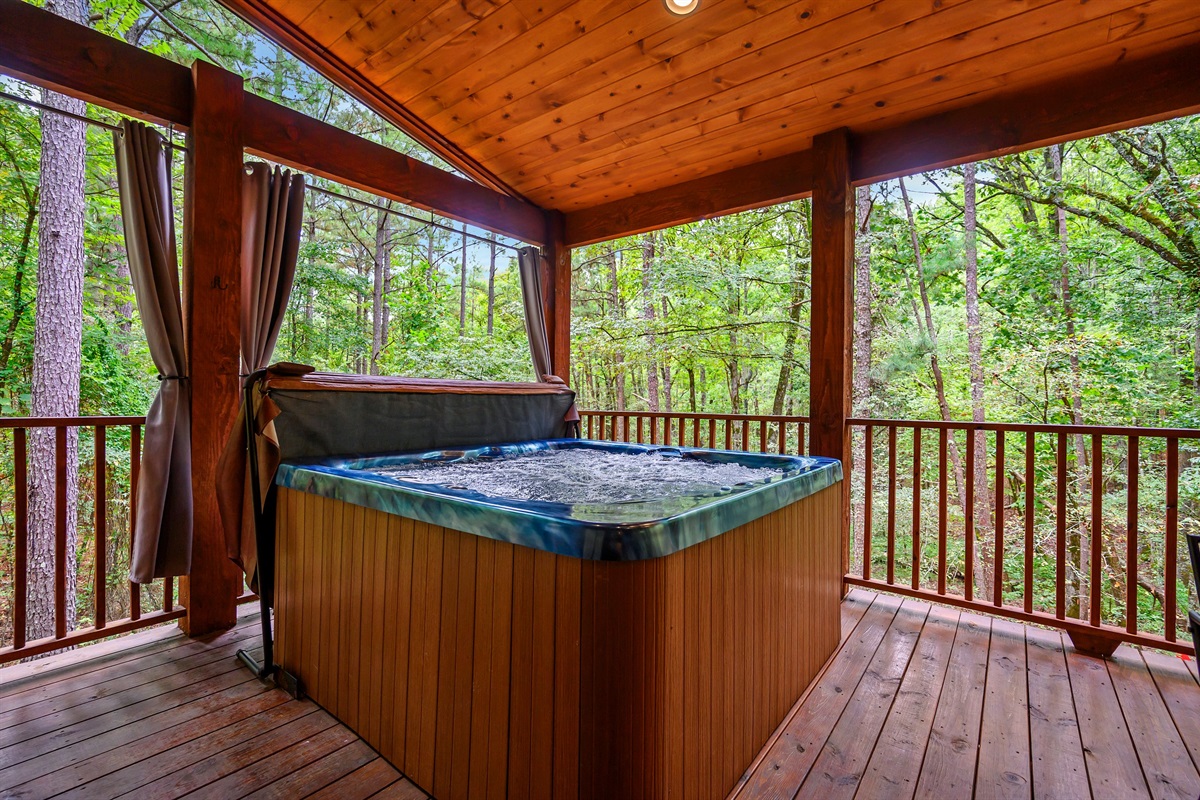 This view!! The hot tub is set up in the perfect location to enjoy the view yet can still be enjoyed on rainy days!