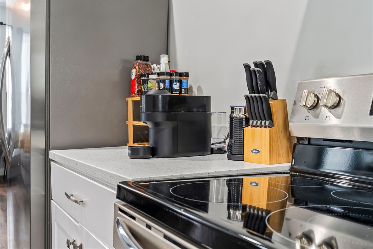 Dedicated cooking prep zone featuring a Nespresso coffee machine, knife set, and essential kitchen tools.