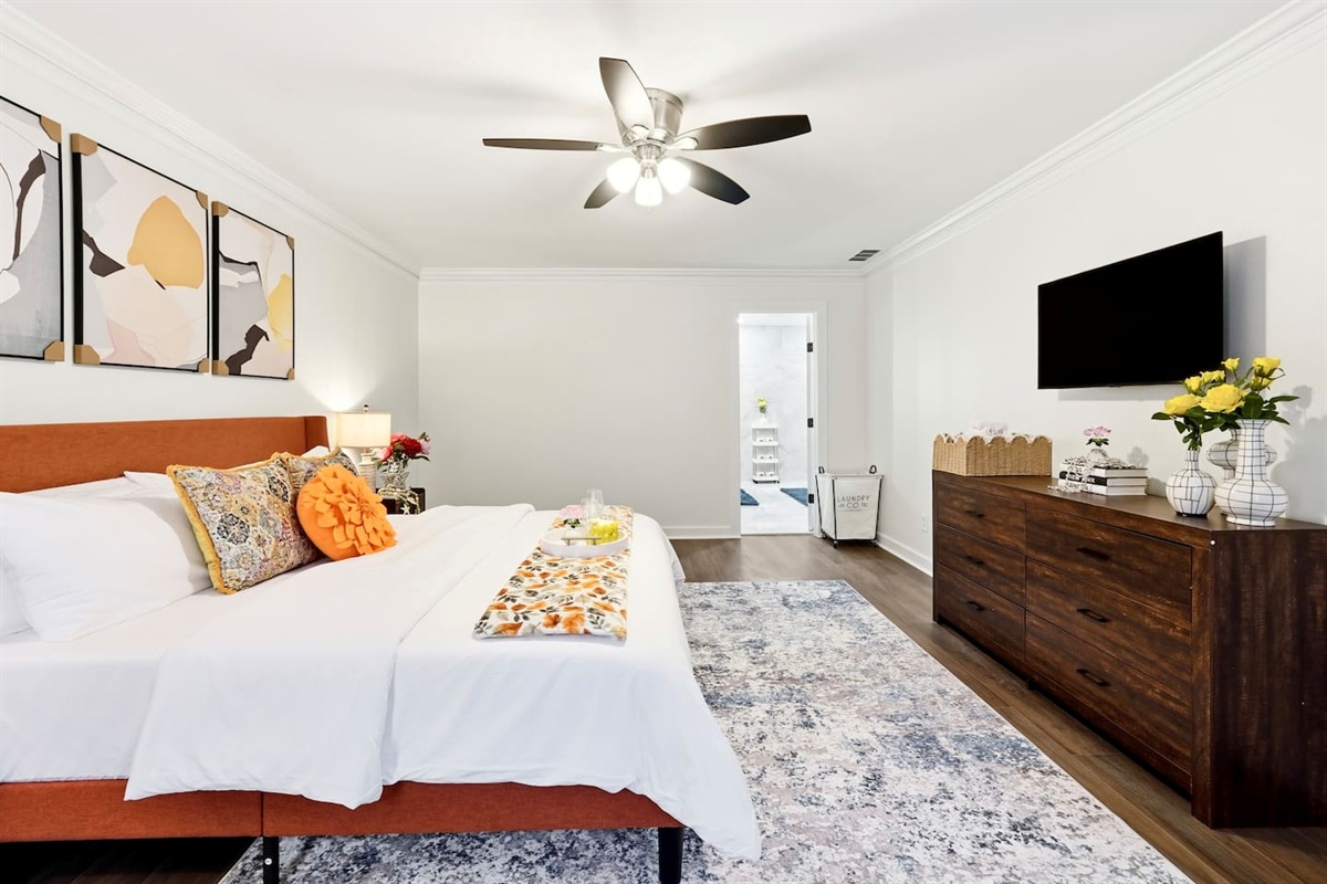 Beautiful second-level master bedroom featuring a king bed, a Roku-powered Smart TV, located all the way to the right at the top of the staircase. This room includes 2 full-body towels, 2 washcloths, and 2 hand towels for your stay.