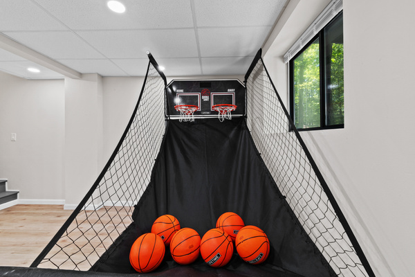 Test your shooting skills with a popular pop-a-shot basketball arcade net setup