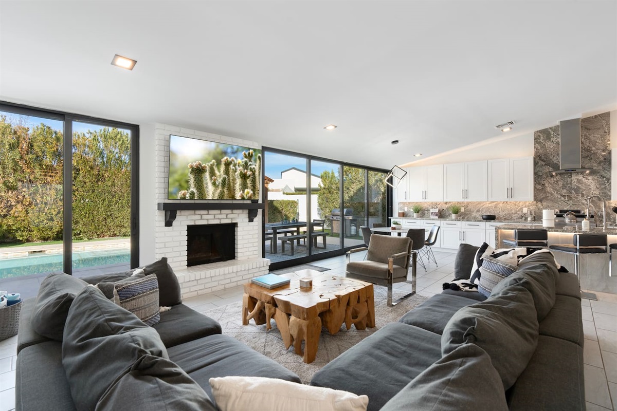 The living area offers a stunning view of the pool.