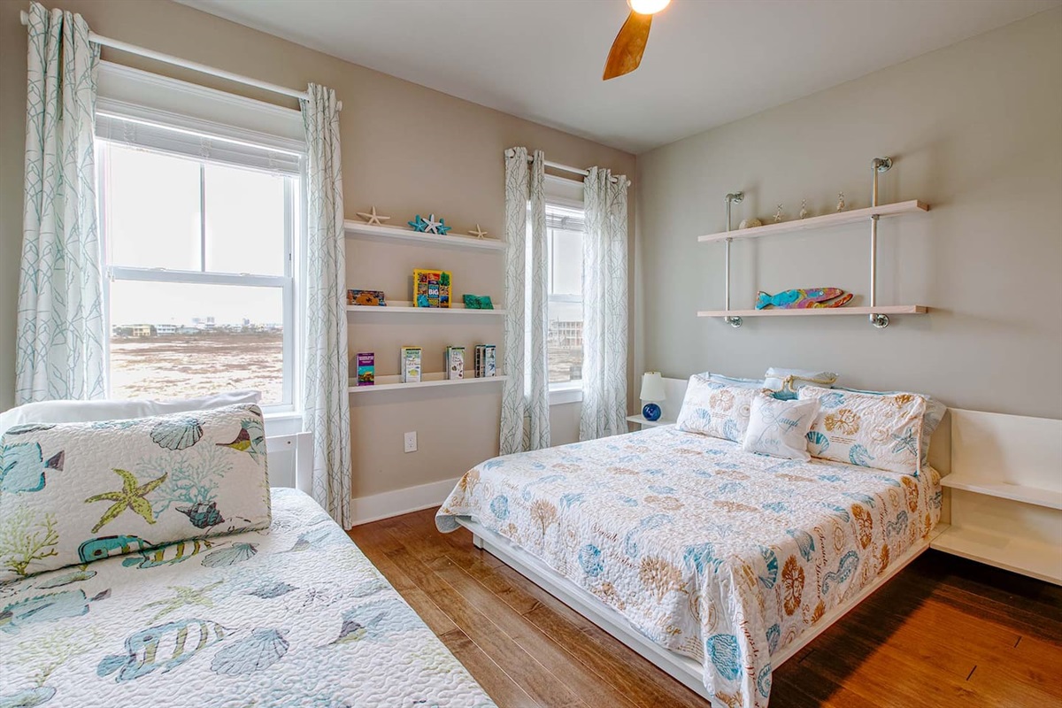 Bedroom #12- Queen bed & twin daybed with en-suite bathroom. Stunning view of the Sound beach. 