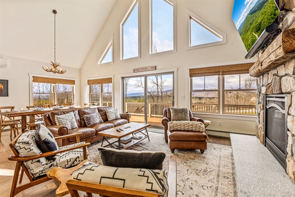 Relax on the open-concept main floor and enjoy mountain views, a fireplace, and a big-screen TV.