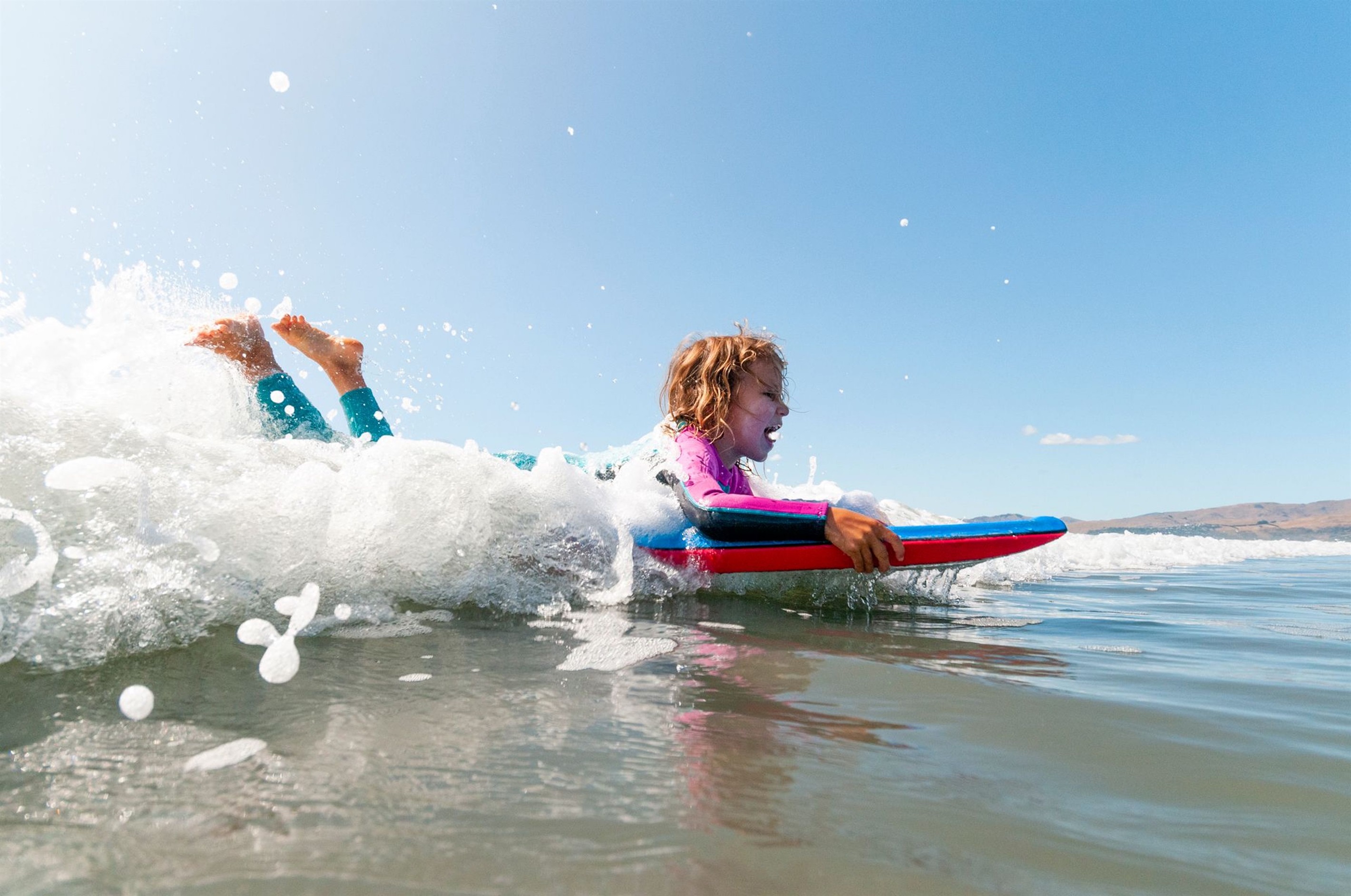 Boogie boarding brings big smiles and little thrills—just one more reason to love the beach life on 30A.